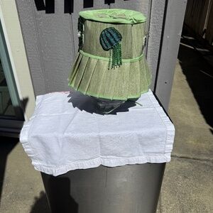 Pastel green custom made bucket hat with beaded patches.
